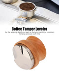 53mm Stainless Steel Coffee Distributor And Espresso Tamper Featuring Quick Depth Adjustment And Comfort Contoured Beech Handle Pro Barista Game Changer for smooth pulls daily on a surface with coffee grounds.