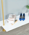 Hella Sturdy Two Tier Industrial Garment Rack With Thick Wood Shelf And Durable Metal Frame Wall Mounted Double Hanging Rods Clothes Storage Shelf For Home Or Boutique with books and blue shoes.