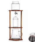 Portable Cold Brew Drip Tower And Adjustable Iced Coffee Maker Featuring Removable Filter For Smooth Extraction with glass and wood design.