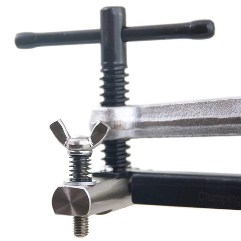 Strong Hand Tools CPL45 pipe fit-up clamp for 2–4 in pipes; silver metal body, black T-handle.