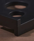 Close-up of black ABS Radius Jig Router Template corner with cutouts, part of 4 Pack with 8 Radius Sizes for Woodworking.