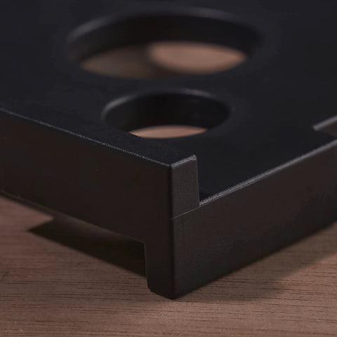 Close-up of black ABS Radius Jig Router Template corner with cutouts, part of 4 Pack with 8 Radius Sizes for Woodworking.