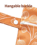 Close-up of Three Piece Waterproof Wet Bag Storage Set For Baby And Travel showing floral design and hangable buckle.