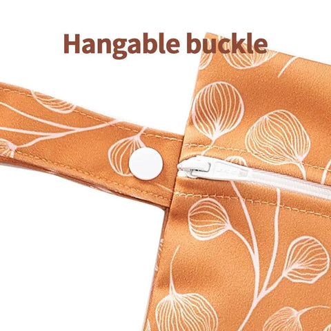 Close-up of Three Piece Waterproof Wet Bag Storage Set For Baby And Travel showing floral design and hangable buckle.