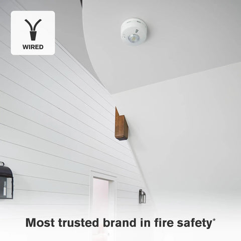Hardwire Smoke Alarm With 10 Year Battery Backup And Strobe Light Wielding Precision Detection mounted on a white ceiling.