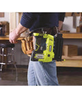 Person holding Airstrike 18V Cordless Brad Nailer P320 One Plus Lithium Powered, tool only, no compressor needed, in workshop