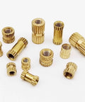 Brass Knurled Insert Nuts Metric Thread For DIY Projects Plus 25pc Assortment M2.5 M3 various sizes and shapes arranged on a white background.