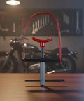 Professional Grade Premium Steel Motorcycle Clutch Spring Compressor Tool Kit with red handle and silver grip on wooden table.