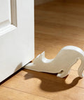 Decorative cat-shaped door stopper in use, fits Black Eco Friendly Door Stopper With Soft Impact Absorbing Block, Quiet Door Bumper