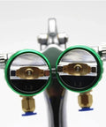Heavy Duty Double Head Pressure Feed Paint Sprayer Featuring Slick Nano Chrome Nozzles And Killer Smooth Coverage For Badass Industrial Coating And Top Shelf Pneumatic Painting Work With 1000ML Pot Capacity And 13 MM Tips For Flawless Results, close-up of dual 1.3mm nozzles.