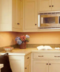 Kitchen with beige cabinets, featuring the Unfinished One And One Quarter Inch Cabinet Knob In Everyday Heritage Style Go To Drawer Knob