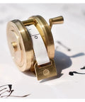 Top Shelf Vintage Brass Mini Tape Measure With Retractable Sewing Ruler That Is Totally Built Tough For All Tailor Jobs Featuring One Meter Gauges You Gonna Adore Using On Every Next Crafting Project Today Right Now, compact design showing measuring tape.