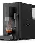 Compact Automatic Espresso Machine With Built In Conical Burr Grinder And Smart Milk Frother brewing espresso into a glass.