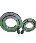 Heavy Duty External Gear Rotary Bearing For Hanging Turntables with large gears and small gears shown in smooth finish.