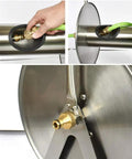 Heavy Duty Stainless Steel Garden Hose Reel Cart With Quick Attach Watering Gun connecting the hose to the brass fitting.