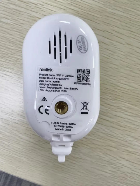 Bottom view of 5MP Solar Outdoor Security Camera Kit With Wireless Spotlight Night Vision, showing model details and battery slot.