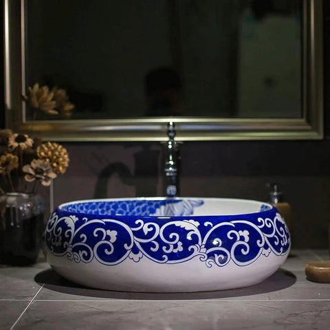 Slick Oval Vessel Sink For Bathroom Vanity Top Notch Premium Porcelain Countertop Wash Basin featuring intricate blue and white hand painted design.