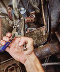 Using 9-inch Locking Pliers Long Nose With Wire Cutter, Fast Release Grip in automotive repair, gripping in tight spaces.