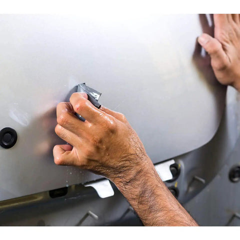 Close-up of hands using Wet Dry Sandpaper Set With Pro Grade Assorted Grits 1000 1200 1500 2000 2500 3000 54 Sheets For Automotive.