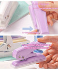 Rugged Heavy Duty Single Hole Punch for papers and crafts shown in hand, purple color, 40 sheets capacity, built to last metal construction.