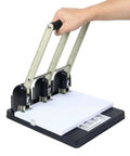 Three Hole Paper Punch for Office and Print Shop, heavy duty metal construction, ergonomic handle, punching up to 150 sheets shown in use