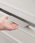Brushed Nickel 10 Pack 5 Inch Edge Finger Cabinet Pulls Aluminum Alloy Hardware being installed on a drawer
