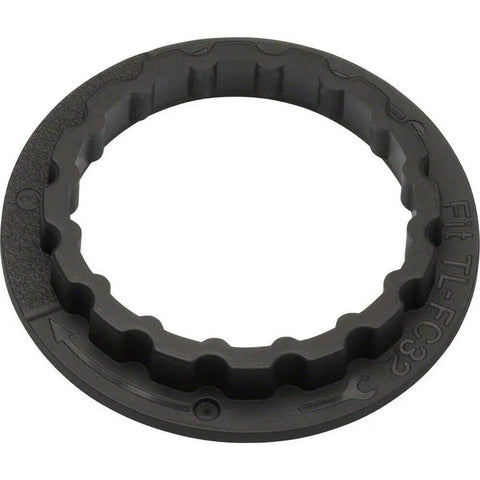 Bottom Bracket Tool Adaptor for SM-BB9000, tough plastic sleeve that grips tight, compatible with TL-FC24 and TL-FC32 tools, visible in ring form