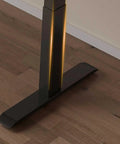 Base of the Straight Up Solid Wood Electric Standing Desk With Drawers, featuring a motorized lift support system.