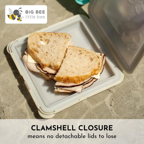 SoftShell Reusable Silicone Food Storage Container With Connected Clamshell Lid Snap Closure Keeps Lids Attached No Lid Drama Leak Resistant Not Leak Proof Easy Clean Travel Ready Meal Prep Microwave Freezer And Dishwasher Safe holding sandwich