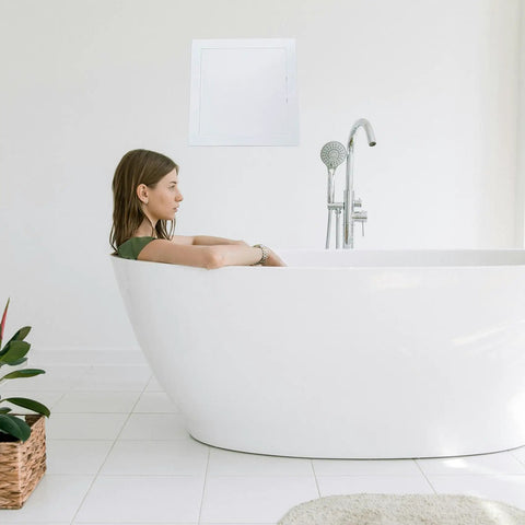 Heavy Duty 6 By 8 Inch Drywall Access Panel With Secure Hinged Cover For Walls And Ceilings shown above a bathtub.
