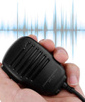 Person holding Hands Free Speaker Microphone With 3.5mm Interface For VX Radios Unidirectional Pick Up Clip On Design