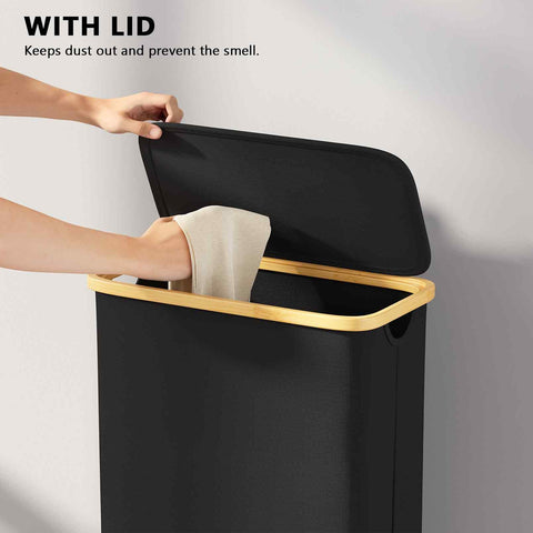 Slim Laundry Hamper With Wheels And Lid, 62L Rolling Clothes Basket With Bamboo Handle being used in black, narrow design.