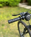 Non Slip Seven Eighths Inch Bike Handlebar Grips Soft TPR Rubber Upgrade End Grips on a mountain bike outdoors.