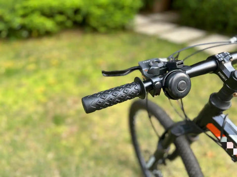 Non Slip Seven Eighths Inch Bike Handlebar Grips Soft TPR Rubber Upgrade End Grips on a mountain bike outdoors.