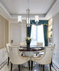 3 Light Brushed Nickel Pendant Chandelier With Clear Glass Shades in elegant dining room setting.