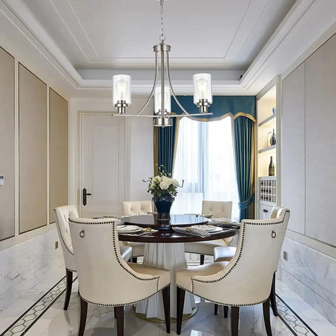 3 Light Brushed Nickel Pendant Chandelier With Clear Glass Shades in elegant dining room setting.