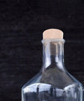 Glass bottle sealed with wood plug simulating Tapered Wood Plugs For Screw Holes With Button Plug Head, Lightweight Furniture Repair Caps.