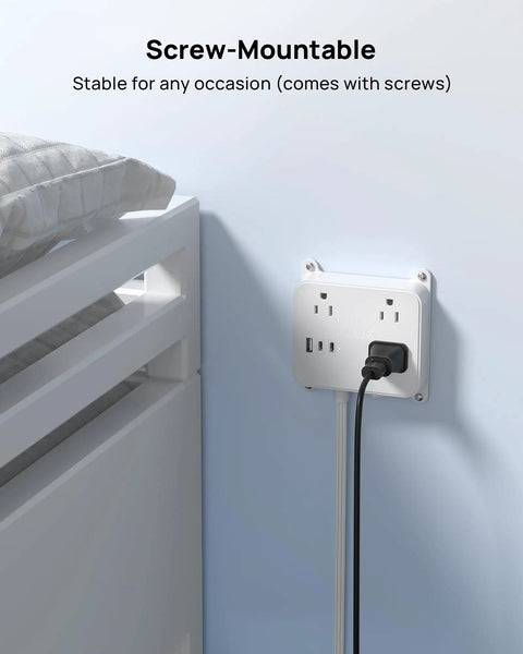 Wall-mounted flat plug power strip with USB ports and 3 widely spaced outlets, 5ft extension cord, white, beside a bed