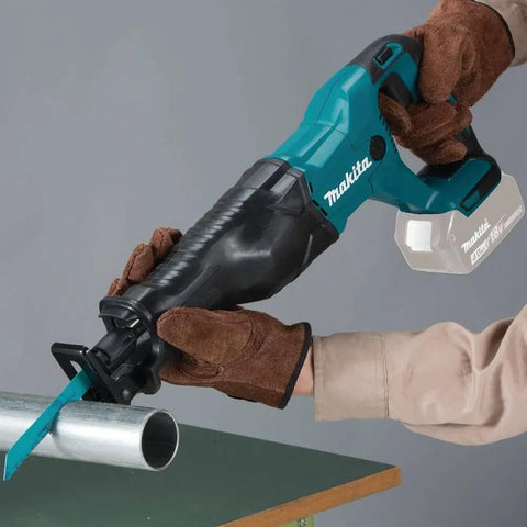 Person using 18V Cordless Reciprocating Saw Tool Only With Variable Speed Trigger And Tool Free Blade Change For Fast Blade Swaps Easy One Hand Use LXT Compatible Great For Demolition Remodeling And Quick Cuts Blue on metal pipe.