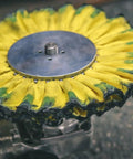 Close-up of a buffing wheel from Aluminum Polishing Kit With Dual Buffing Wheels Polishing Compounds Right Angle Grinder Safety Flange Pro Red Hand