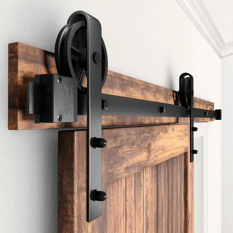 Heavy Duty Sliding Barn Door Hardware Kit Black 6 Ft Track System With Silent Glide Wheels installed on wooden door