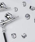 Seven Piece Airbrush Adapter Kit With Multi Size Fittings Including 1/8 In, 1/4 In And M5 BSP Threads shown with metal couplings