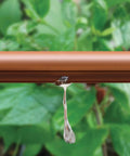 Rain Bird 1/2-inch emitter tubing, brown, drip irrigation with water dripping from emitter