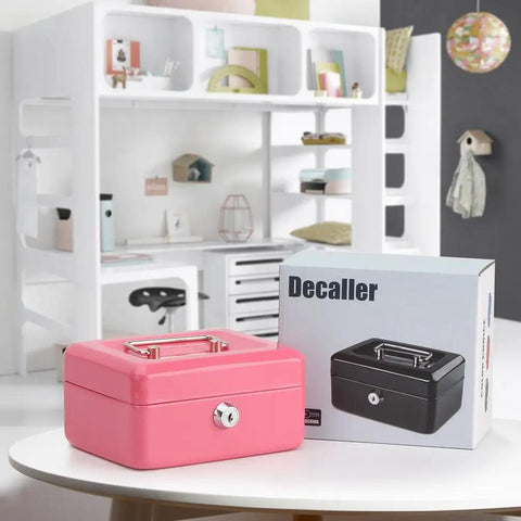 Small Pink Cash Box With Key Lock Double Layer Metal Money Box placed on a table, home office background