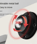 Close-up of black 1-inch swivel caster wheel with adhesive base attached to furniture, showing 360-degree rotation.