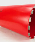 Red 10-inch diamond core drill bit with segmented edge for concrete and masonry.