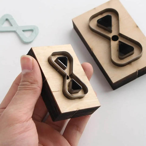 Dope Bow Shape Leather Cutting Die Set Two Pack For DIY Leather Projects with wooden frame and Japanese steel blades shown in hand