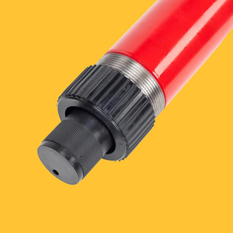 Red hydraulic floor jack pump end with black knurled cap and silver threaded collar