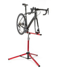 Sprint Bike Repair Stand With Tripod Base And Dropout Style Mount Built To Last Compact Workstand holding a bike