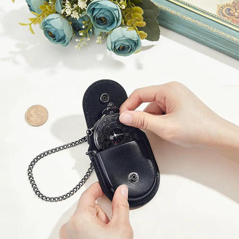 Hella Solid Pocket Watch Case Crafted From Premium Pu Leather Featuring A Snazzy Antique Bronze Chain Secure Snap Closure And Roomy Compartment For Keeping Your Favorites Safe In Classic Black, showing pocket watch being placed inside.